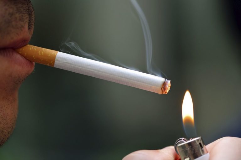 Man lighting cigarette