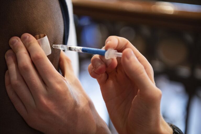 Man receiving COVID-19 vaccine