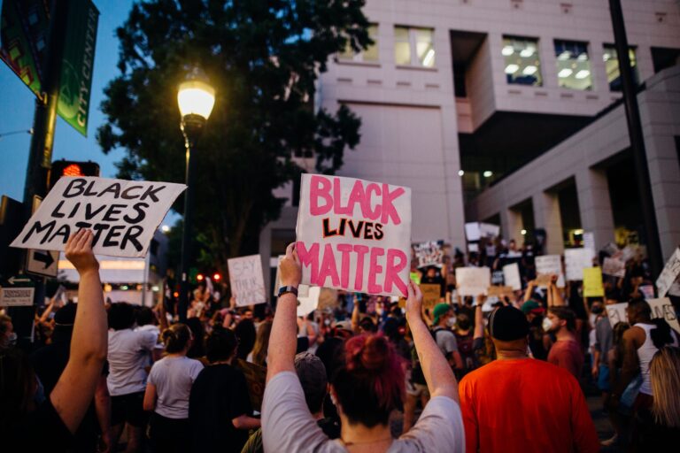 protesters holding signs