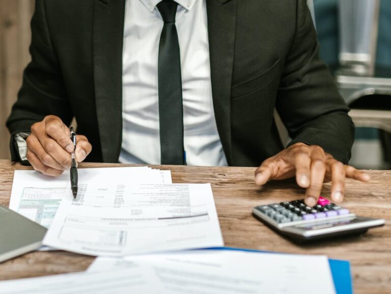 man in black suit working