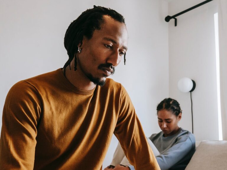 upset black couple during dispute in bedroom