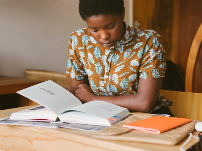 photo of woman reading books
