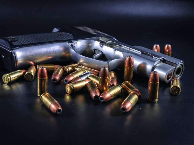 metal pistol with brass copper bullets