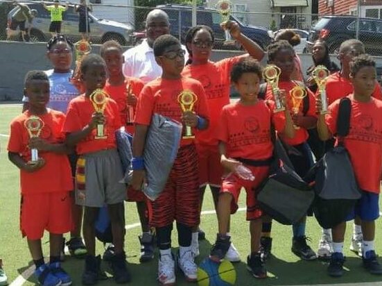 R.E.A.C.H. athletes with trophies