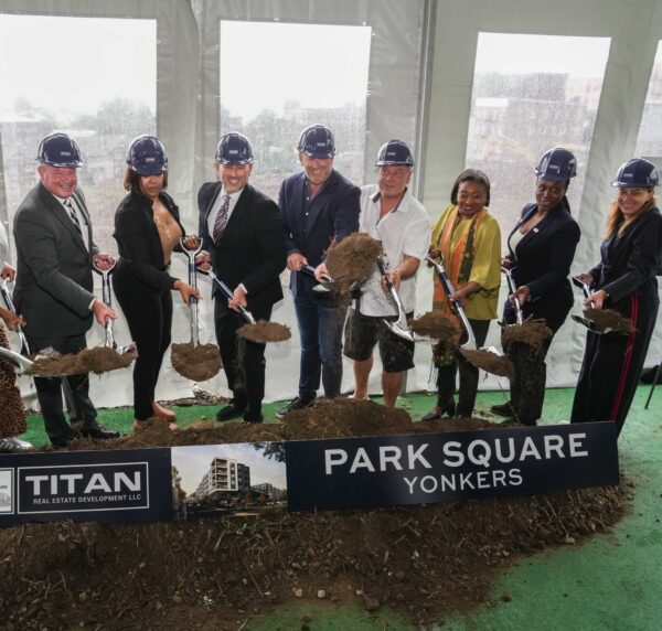 officials with shovels