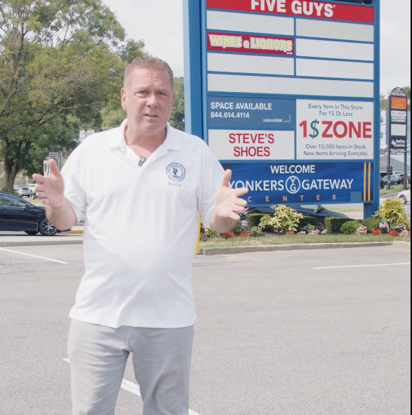 Mayor in front of stores