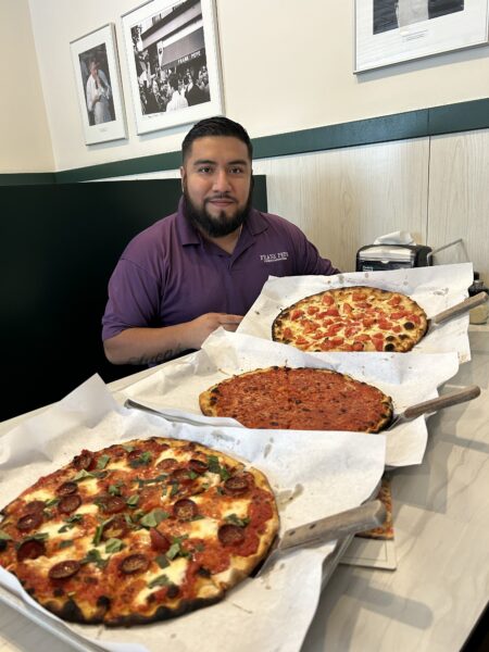 three Frank Pepe pizzas and the manager