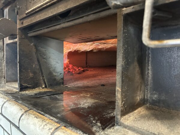 flames inside the Frank Pepe pizza oven