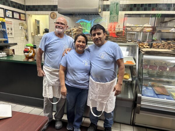 three bagel store workers